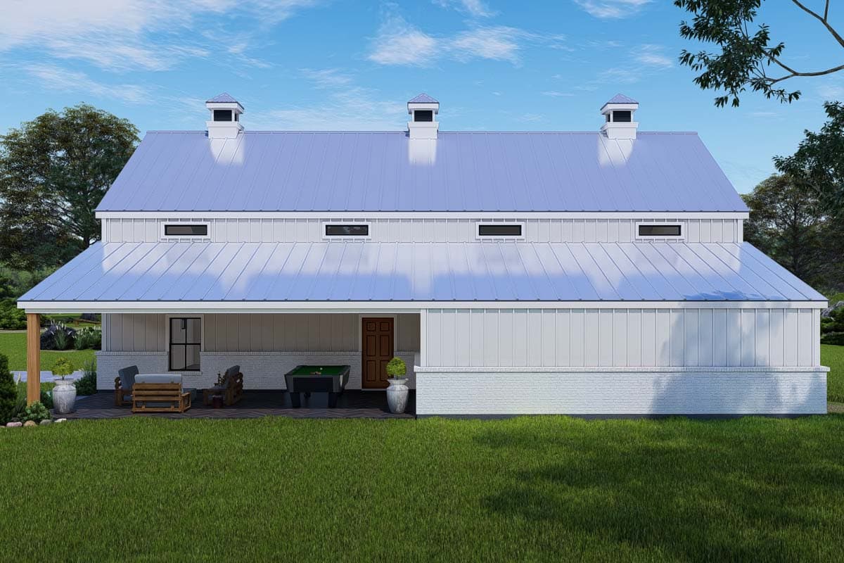 Modern Farmhouse house plan exterior with metal gambrel roof, dormers, and covered porch with outdoor seating and pool table.