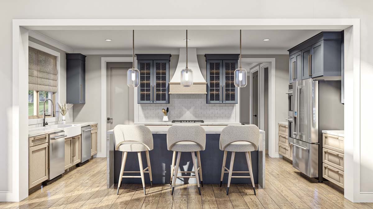 Kitchen with island seating, subway tile backsplash, range hood, stainless steel appliances, and farmhouse sink.