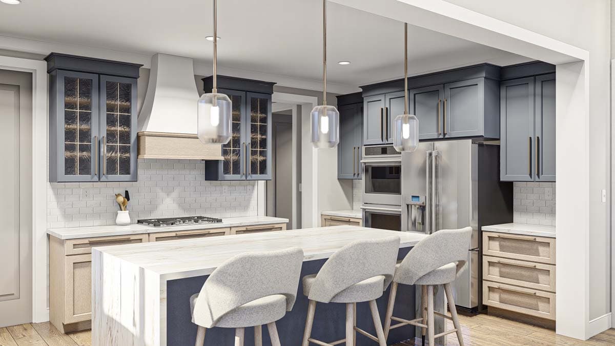 Modern kitchen with island seating, gray cabinetry, stainless steel appliances, and subway tile backsplash.