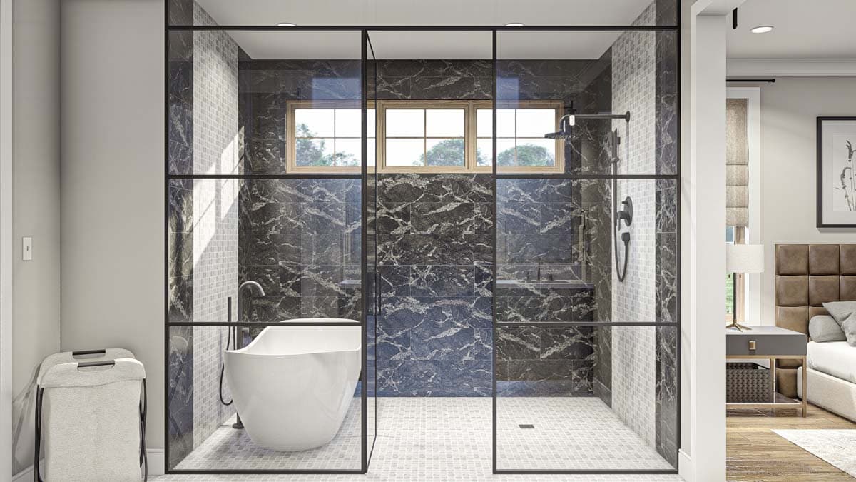 Modern bathroom with freestanding tub, glass-enclosed shower, marbled and tiled walls, and a three-pane window.