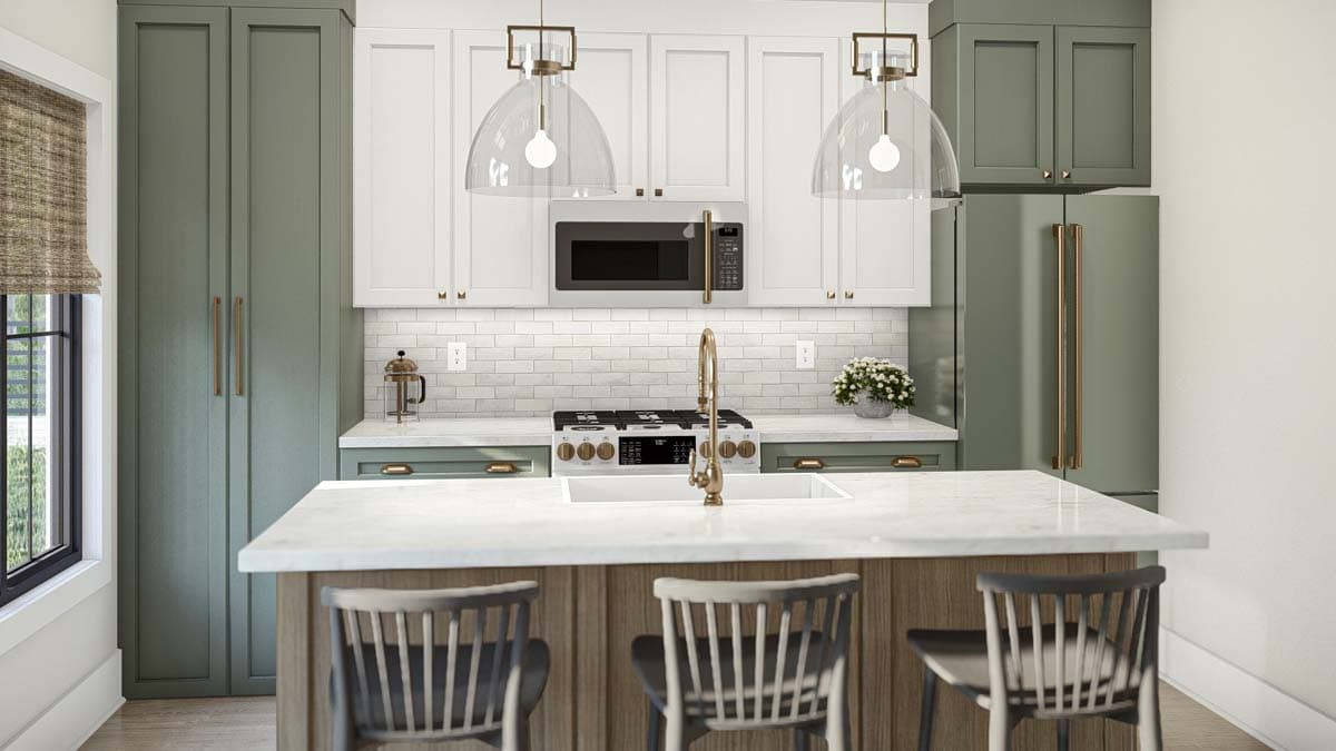 Kitchen with green cabinetry, white subway tile backsplash, island with seating, pendant lighting, and stainless steel appliances.
