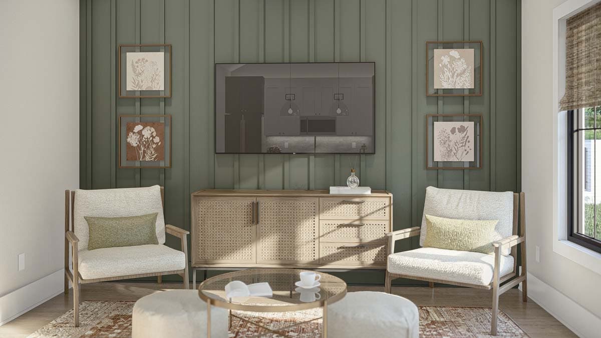 Living room with textured green paneled wall, media console, two chairs, coffee table, and botanical art.
