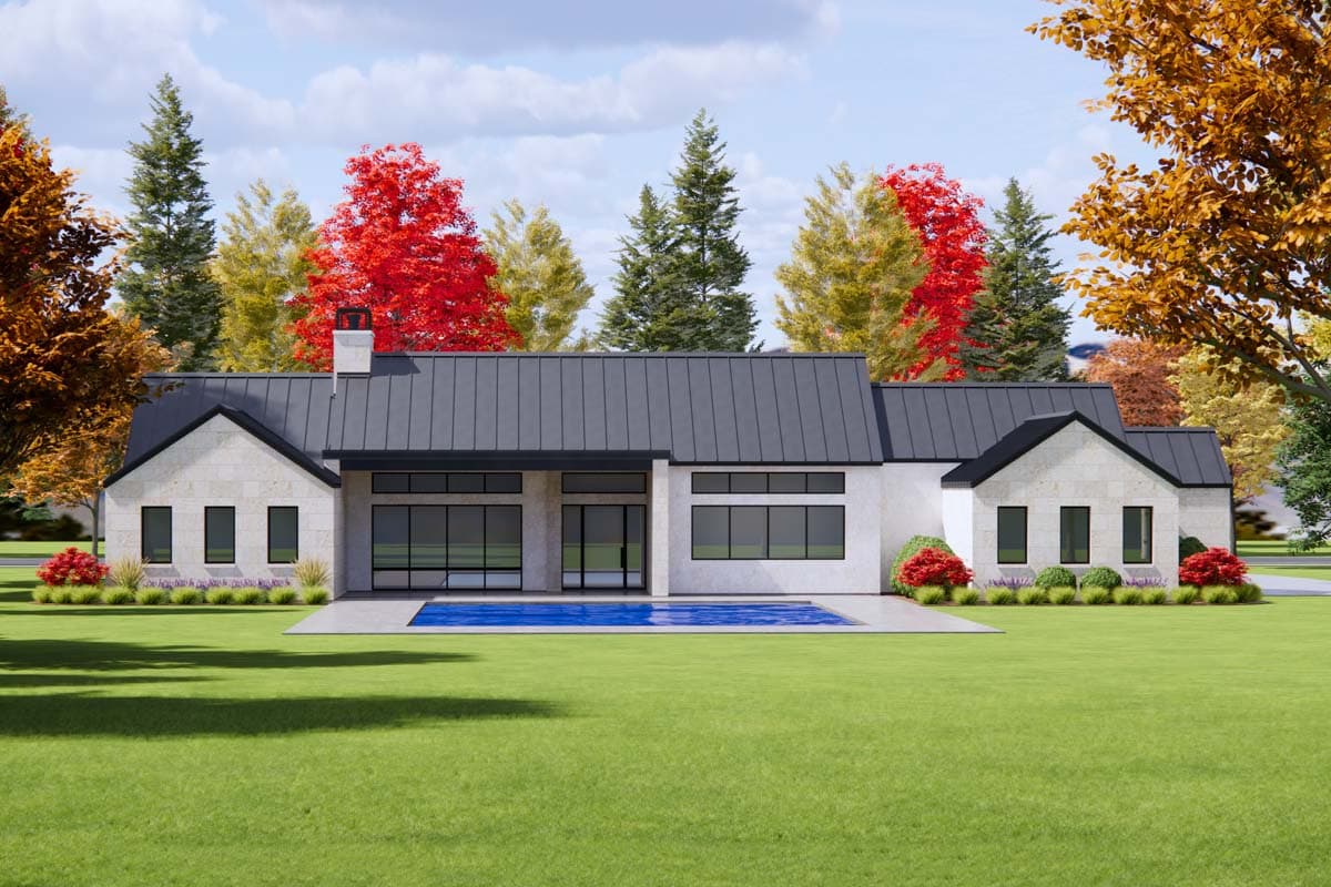 Modern house plan exterior with gabled wings, stone facade, metal roof, large windows, and central glass doors opening to pool.