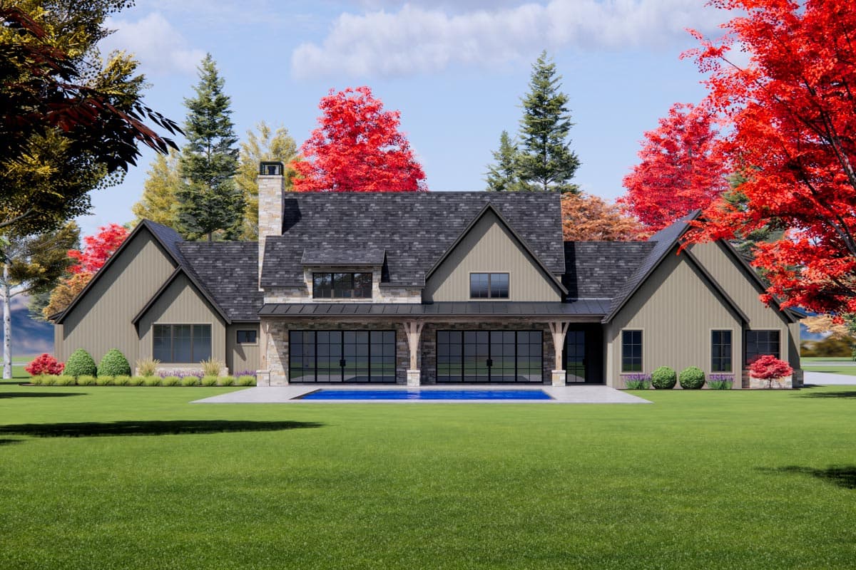 House plan exterior: Modern Farmhouse style, two stories, stone chimney, gabled dormers, and wide glass doors opening to a pool.