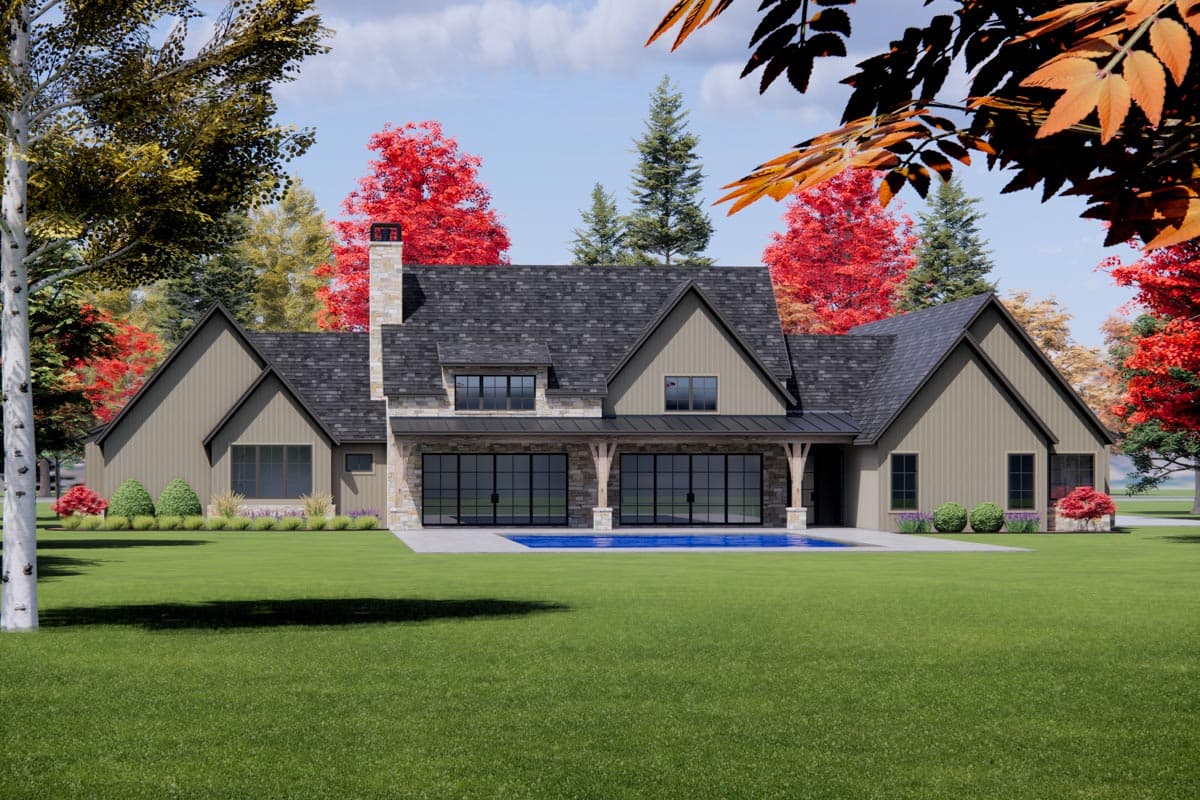 House plan exterior: Modern Farmhouse style, one story, with stone chimney, gabled dormers, and covered patio overlooking pool.