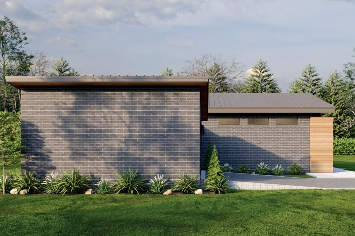 Modern house plan exterior with dark brick, flat roof, and wood accent siding. Single story.