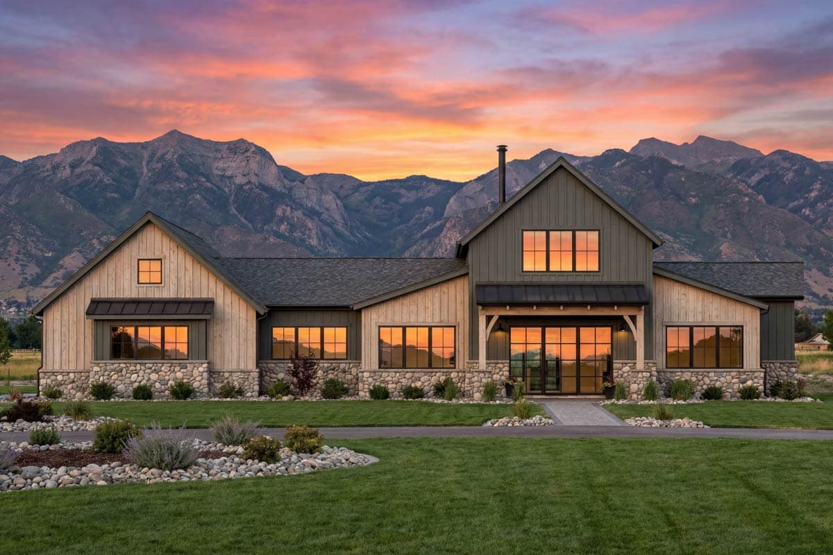 Modern Farmhouse house plan exterior with stone and wood siding, large windows, and gable rooflines.