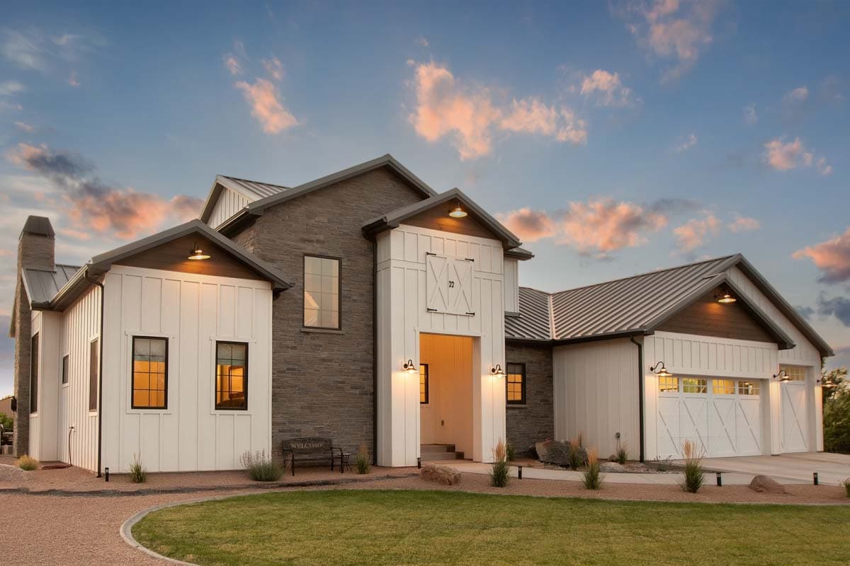 Modern Farmhouse house plan exterior with stone accents, metal roof, board and batten siding, and a three-car garage.