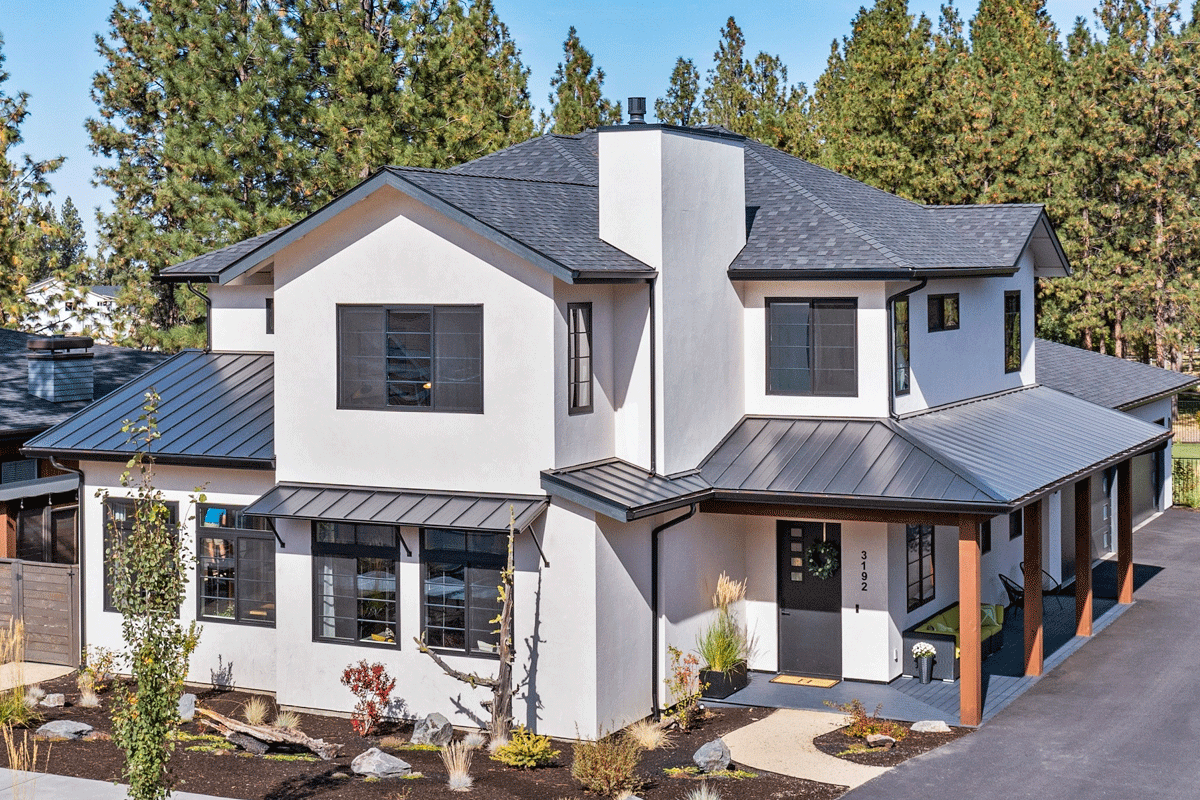 Modern house plan exterior with a stucco finish, multiple gables, a prominent chimney, and a covered porch with wood columns.
