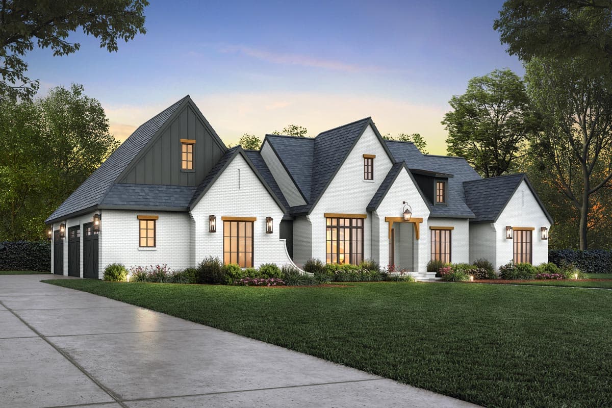 House plan exterior of a two-story Modern Farmhouse with white brick, gables, dormers, and a three-car garage.