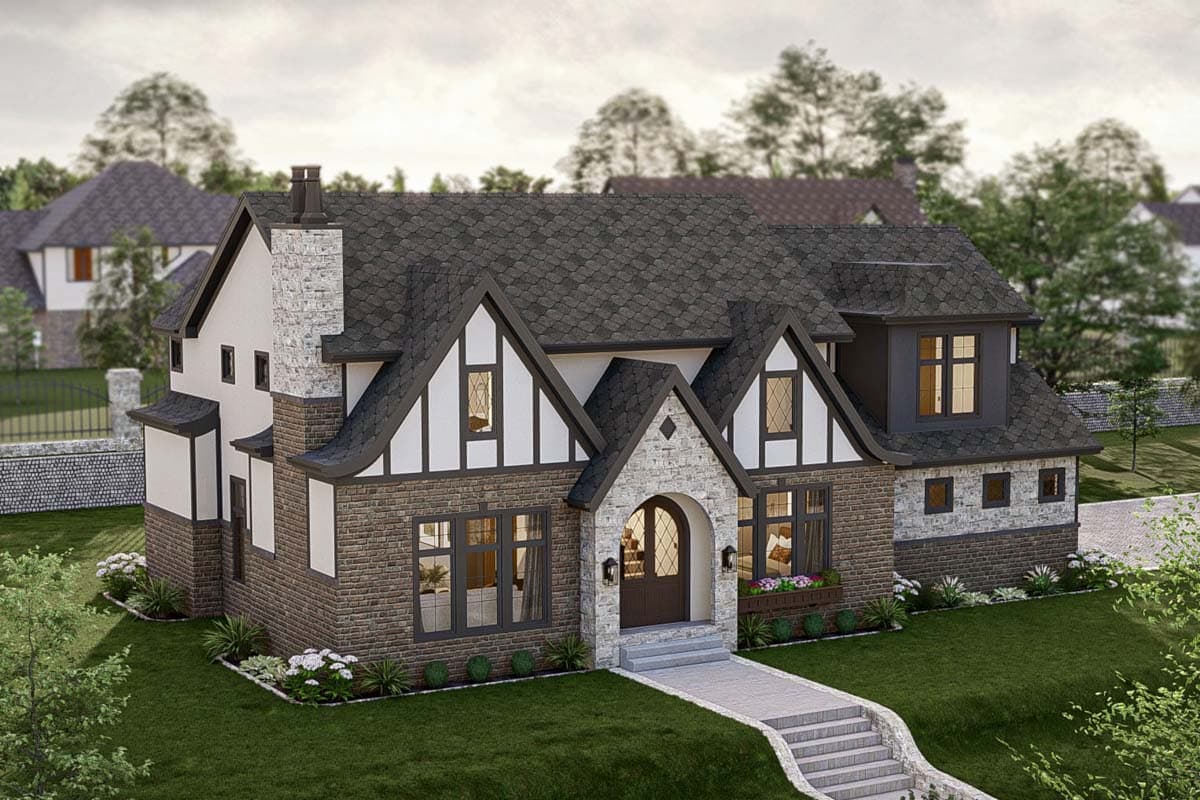 Tudor-style house plan exterior with stone and brick facade, prominent gables, and a large chimney.