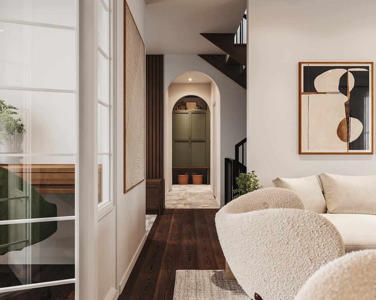 Interior design with wooden floors, neutral colors, modern art, archway, and white furniture. Cozy and welcoming ambiance.