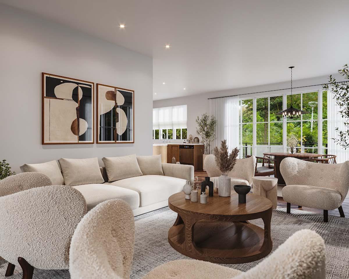 Modern living room with neutral colors. Features a large sofa, fuzzy chairs, wooden coffee table, and large windows with greenery views.