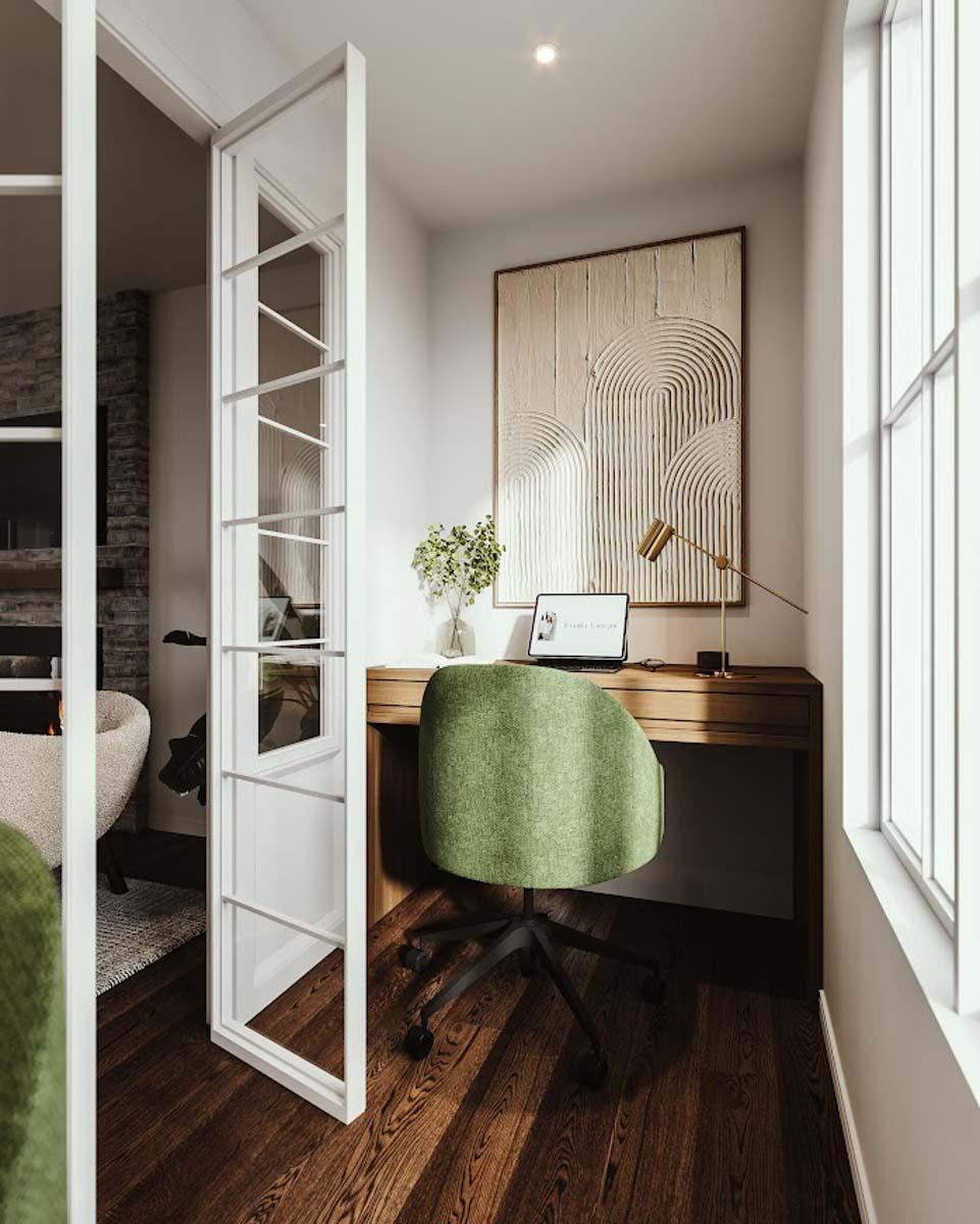 Cozy home office with a wooden desk, green chair, abstract art, and glass door. Natural light floods the space. 