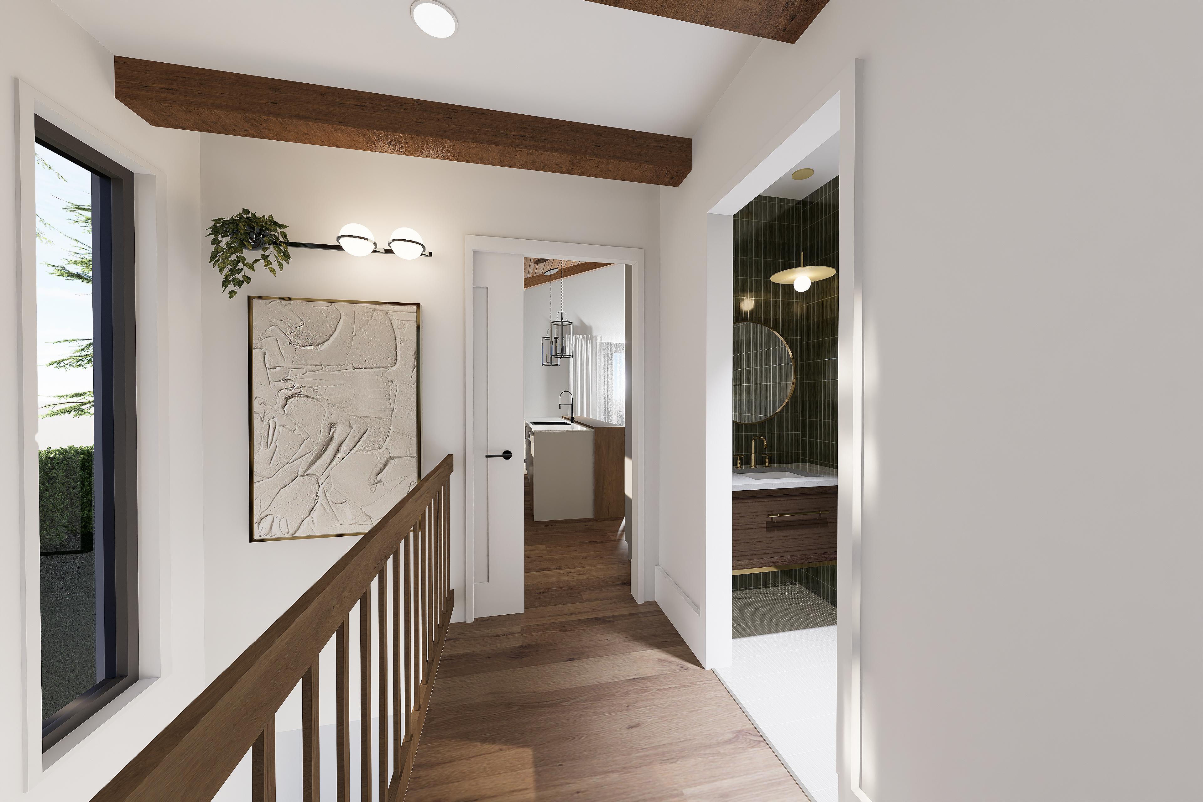 Interior view showing a hallway with wooden beams, a staircase railing, and doorways to a bathroom and kitchen.