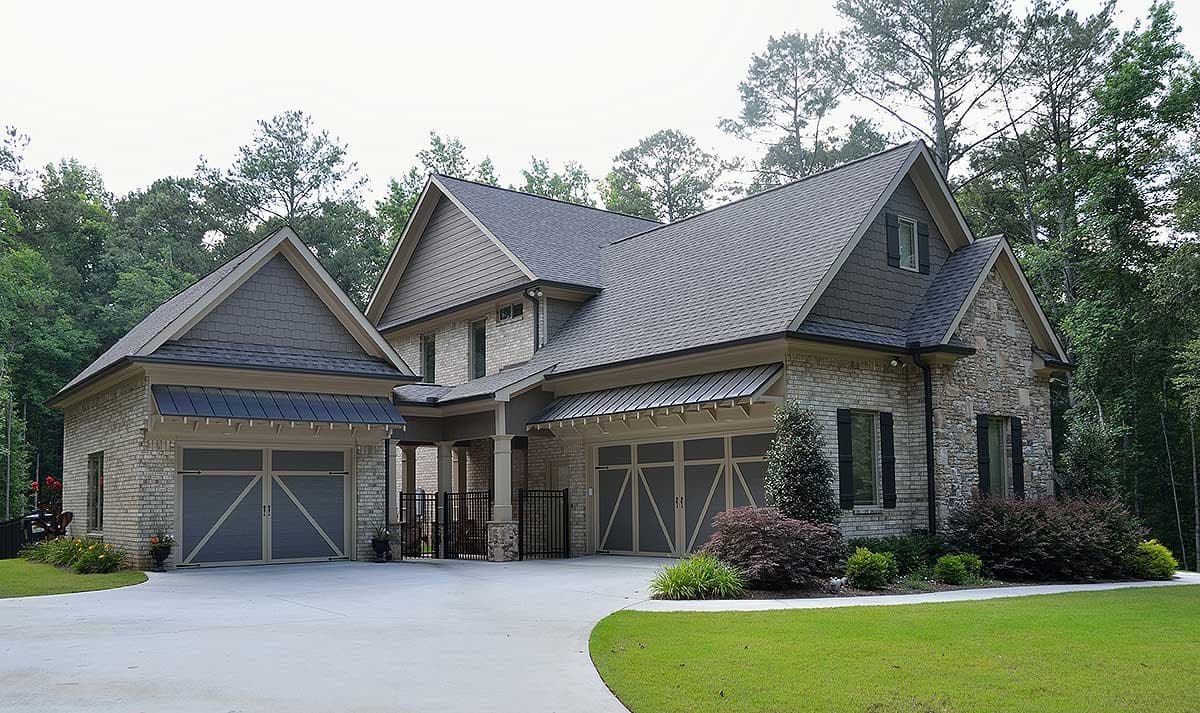 House plan exterior of a two-story home with a three-car garage, stone accents, and multiple gables.