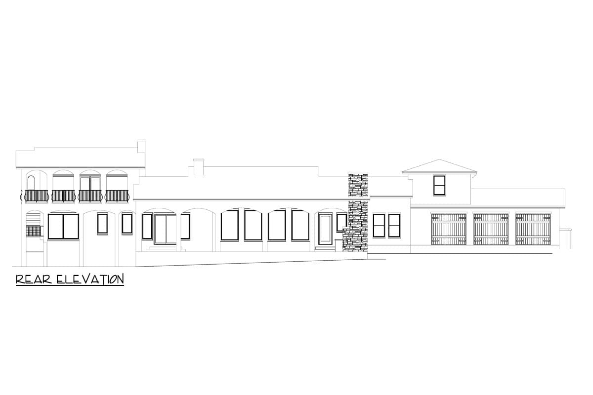 Rear elevation drawing of a house plan featuring balconies, numerous windows, a stone chimney, and a three-car garage.