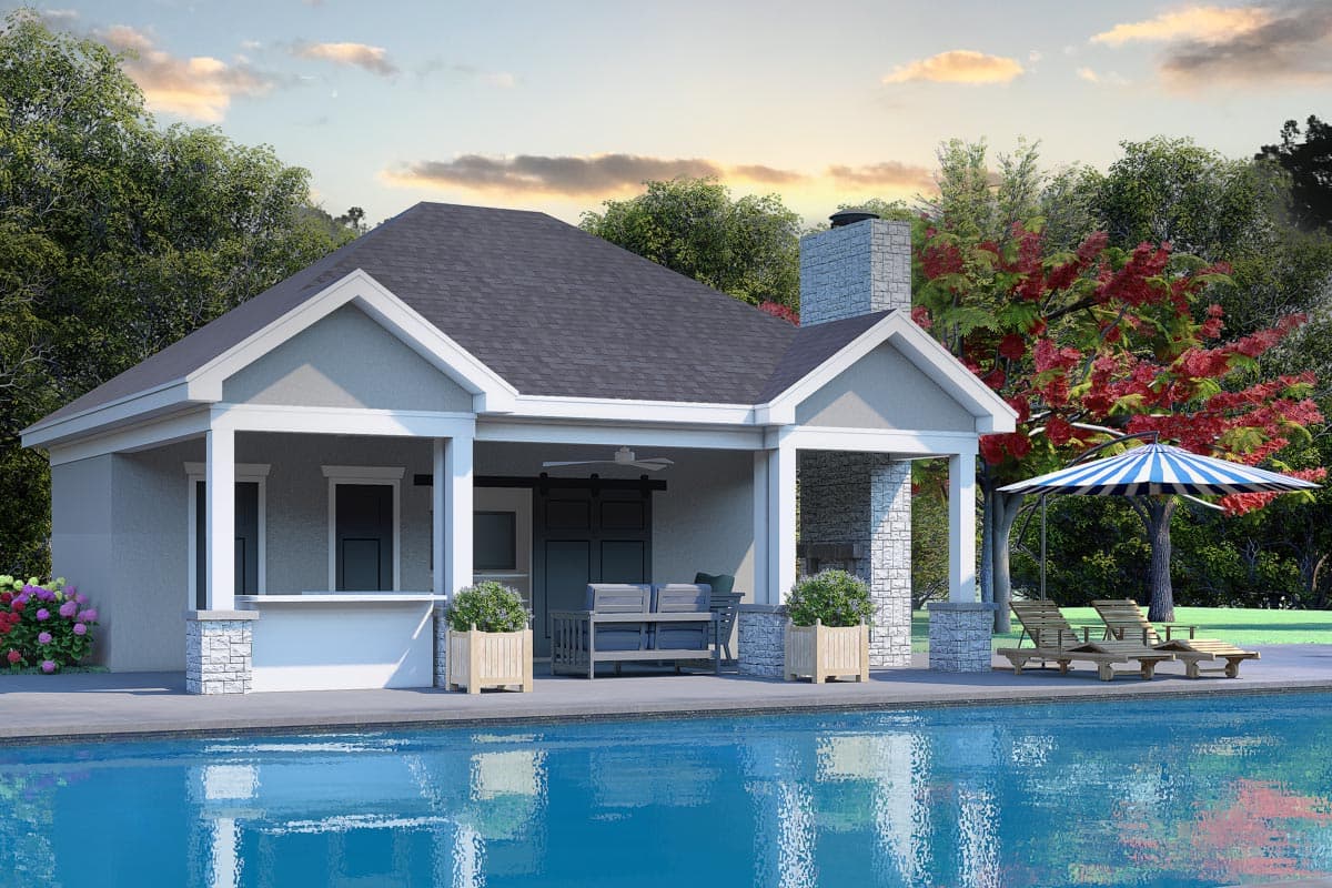 House plan exterior. One-story design with gable roof, covered porch, and stone-clad chimney. Includes a pool area with lounge chairs and umbrella.