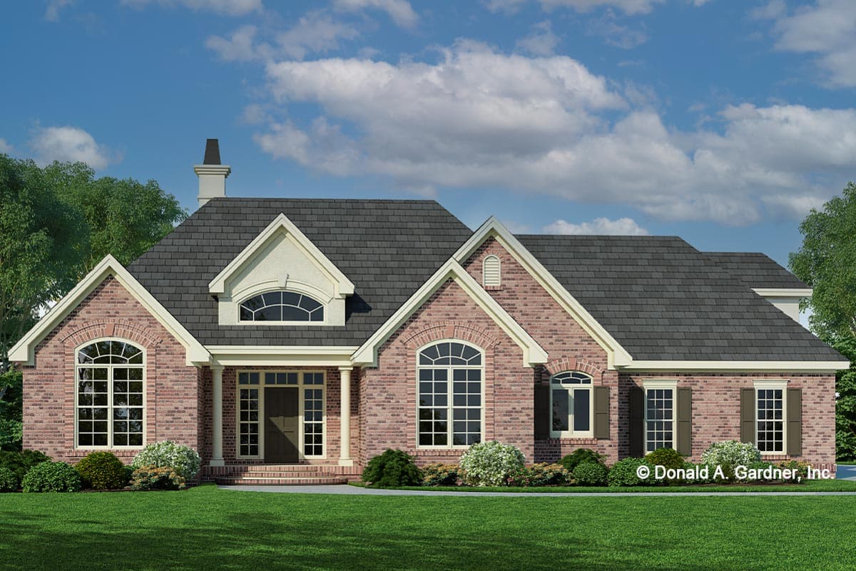 House plan exterior with brick facade, multi-gabled roof, arched windows, and a covered entry porch.