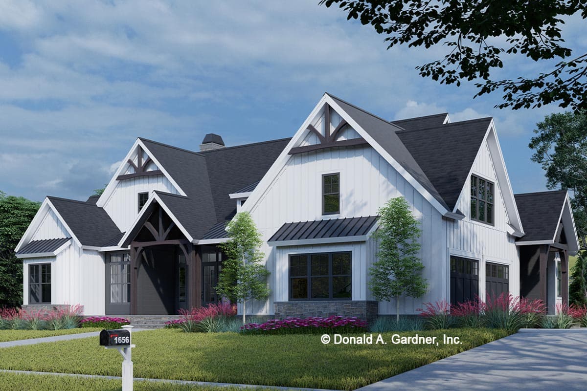 Modern Farmhouse house plan exterior with white board and batten siding, dark gables, and two-car garage.