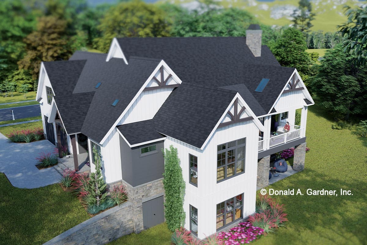 House plan exterior: Modern Farmhouse style with multiple gables, a covered porch, stone foundation, and a two-car garage.