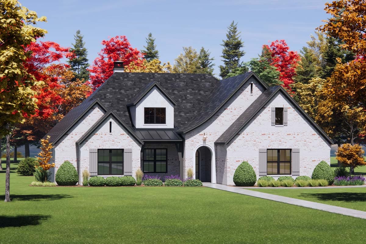 House plan exterior: One-story home with white brick, arched entryway, dormer, and asymmetrical gables.