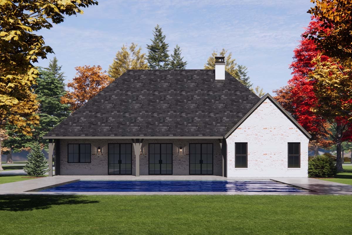 House plan exterior: One-story modern farmhouse with white brick, metal roof, covered patio with large glass doors, and gabled end.