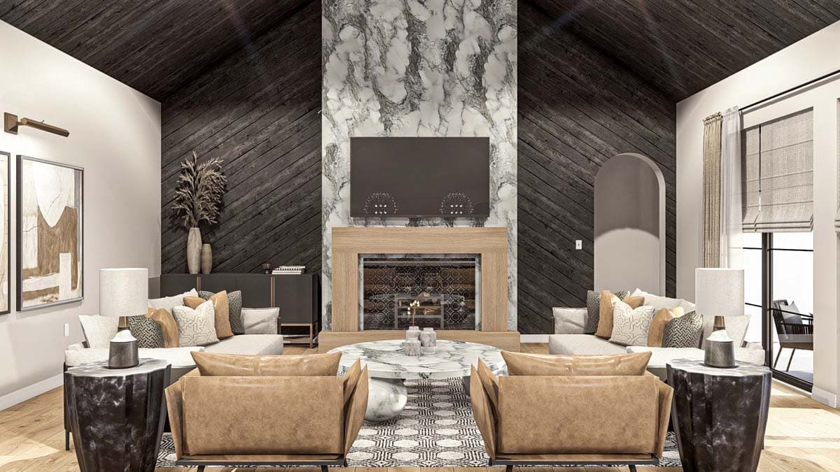 Living room with vaulted ceiling, fireplace with marble surround, and paneled accent walls.