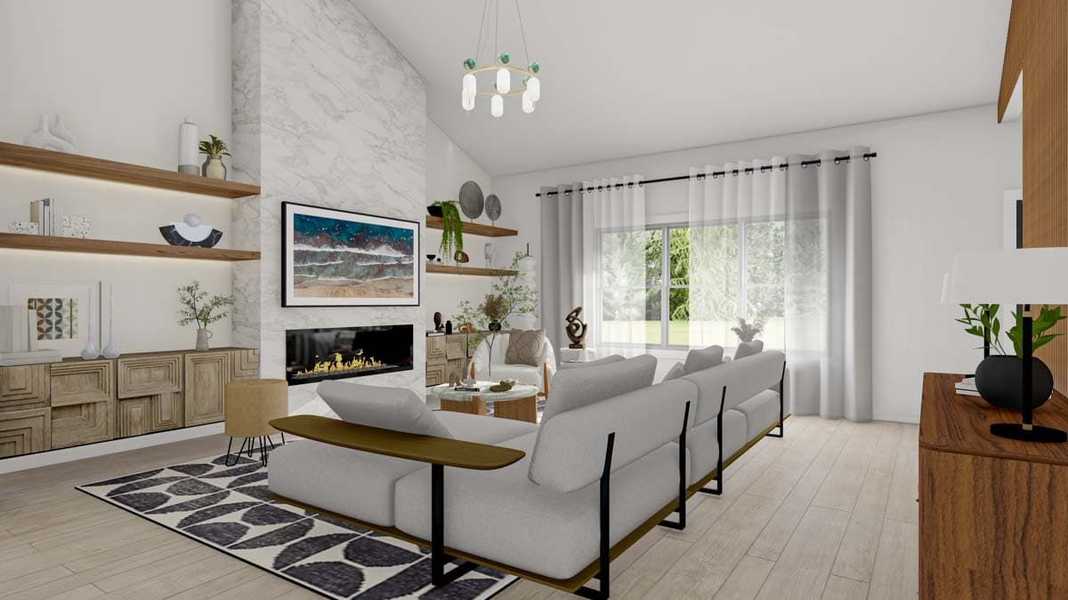 Living room with sectional sofa, fireplace, vaulted ceiling, and large windows. Features built-in shelving and a marble accent wall.