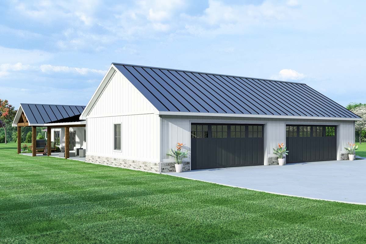 Modern Farmhouse house plan exterior featuring a white board and batten siding, stone foundation, metal roof, and a three-car garage.