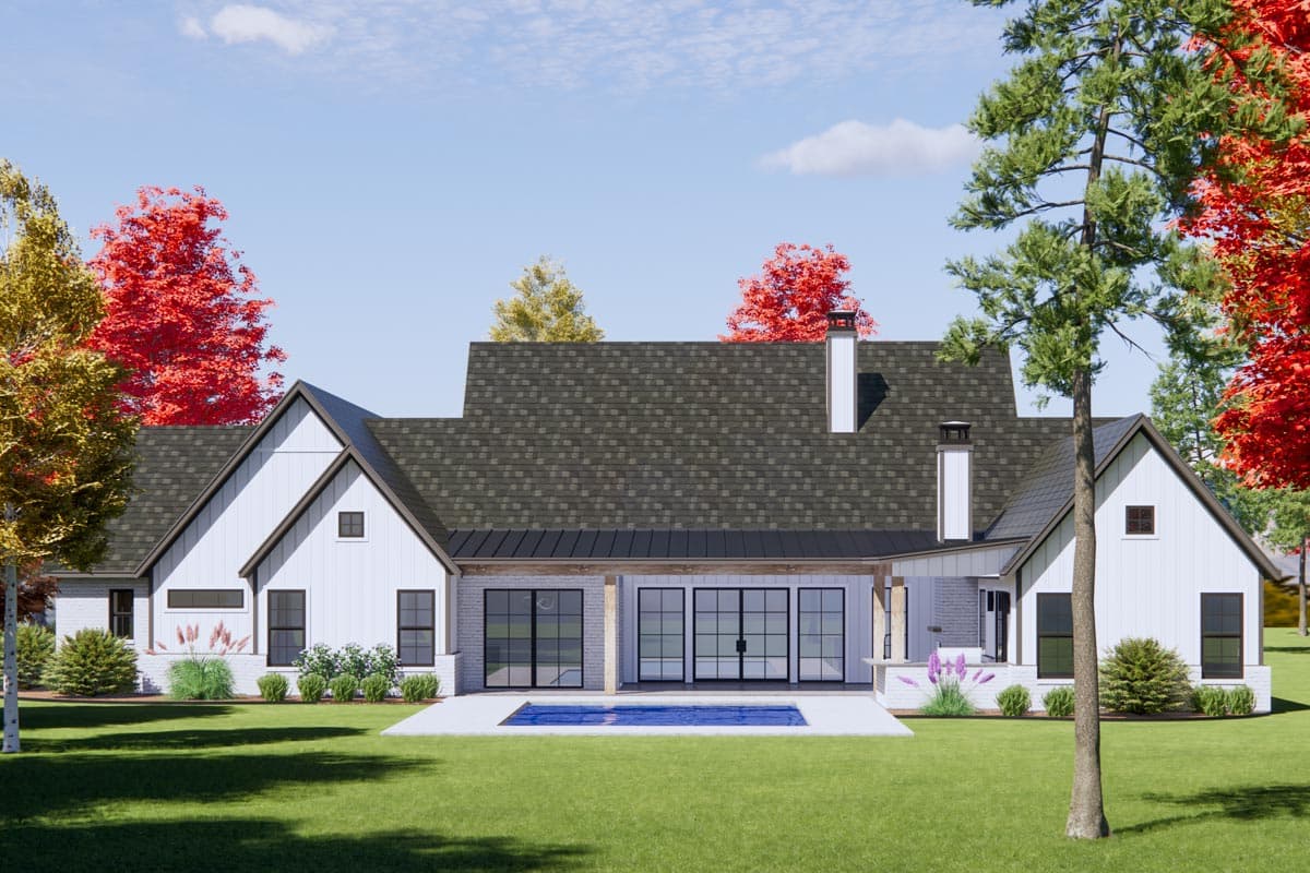 Modern Farmhouse house plan exterior with gabled rooflines, white board and batten siding, brick accents, and large sliding glass doors.