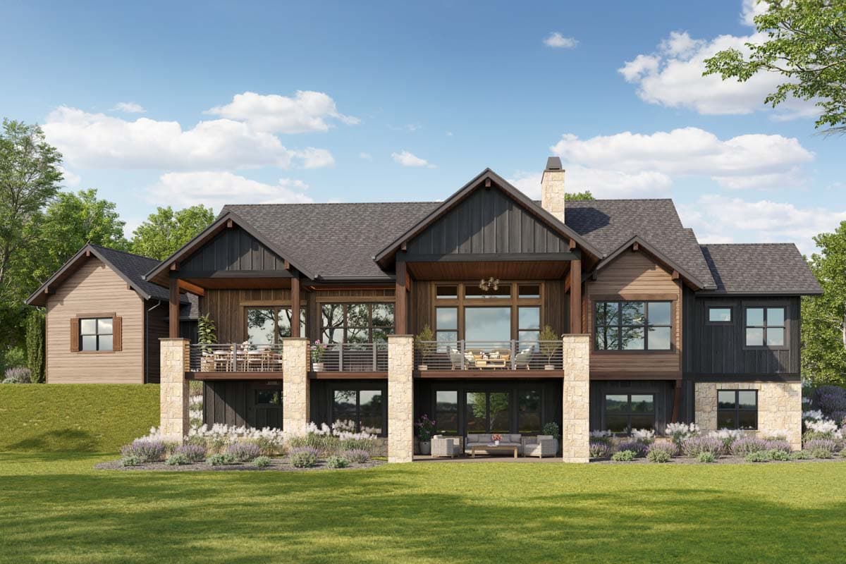 House plan exterior: Modern Farmhouse style, multiple gables, two stories, balconies, stone pillars, and wood siding.