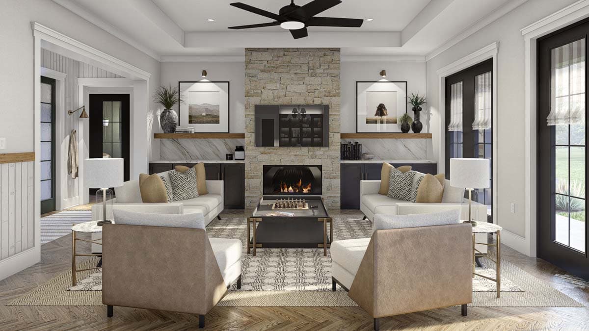 Living room with stone fireplace, built-in cabinets, vaulted ceiling with fan, and double doors.