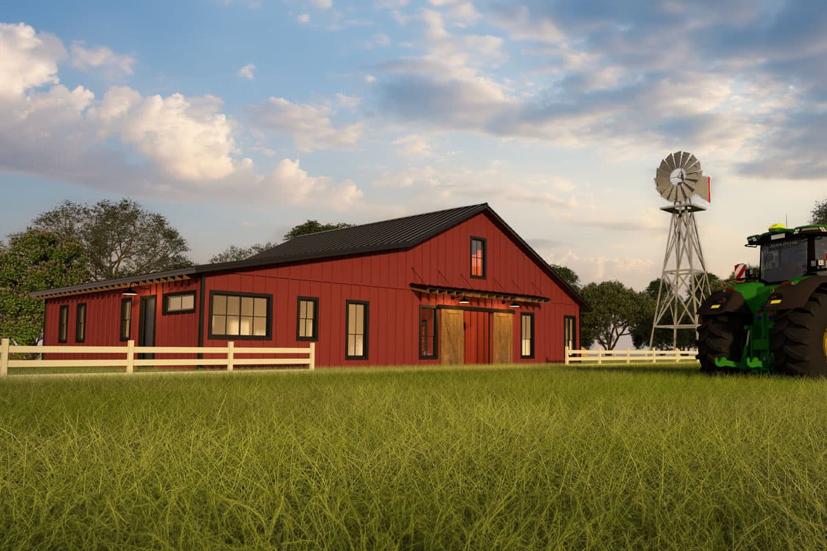 Modern farmhouse exterior with red siding, black metal roof, large sliding barn doors, and numerous windows, beside a windmill and tractor.