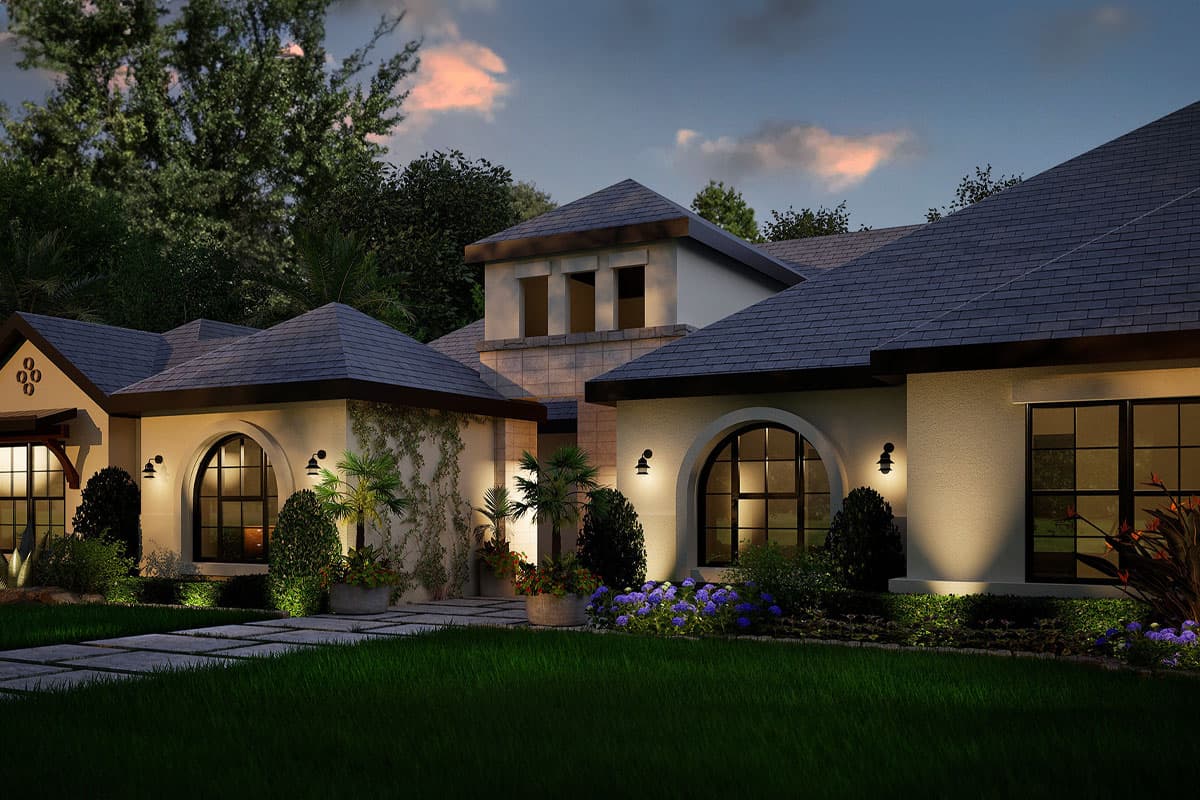 House plan exterior: Mediterranean style with a hipped roof, arched windows, and a central tower.
