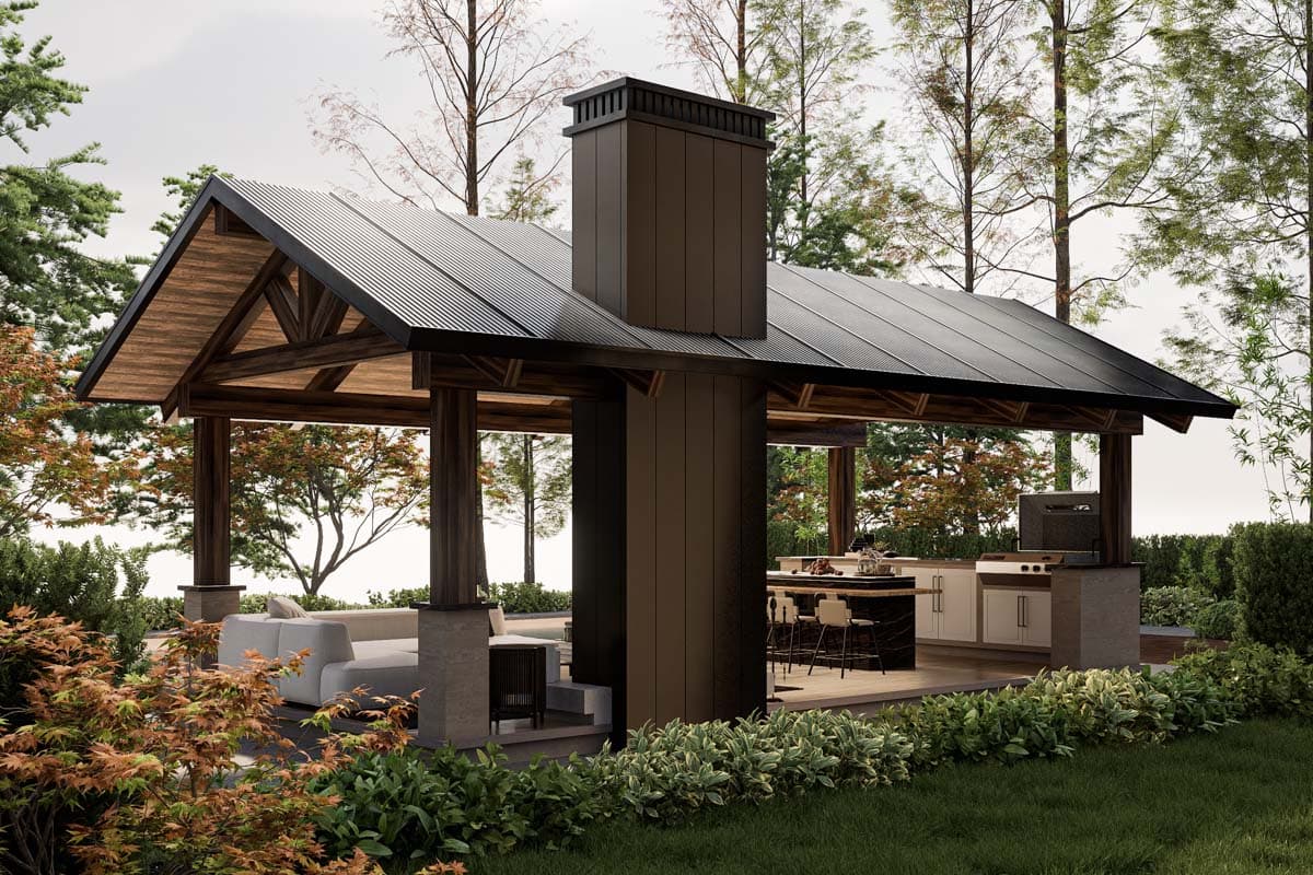 Outdoor living structure with open-air kitchen, bar seating, and lounge area under a pitched roof with exposed wooden beams.
