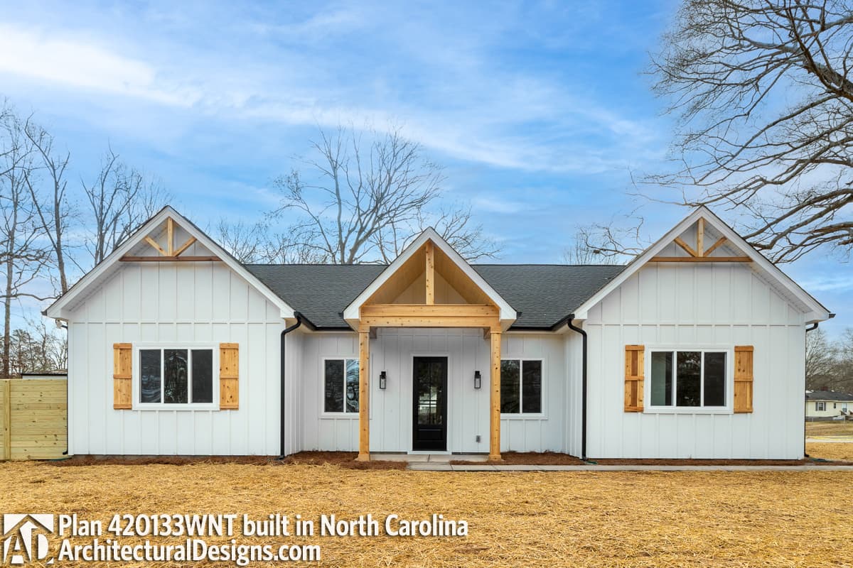 Modern Farmhouse house plan exterior with gable trim, board and batten siding, and exposed rafter tails.