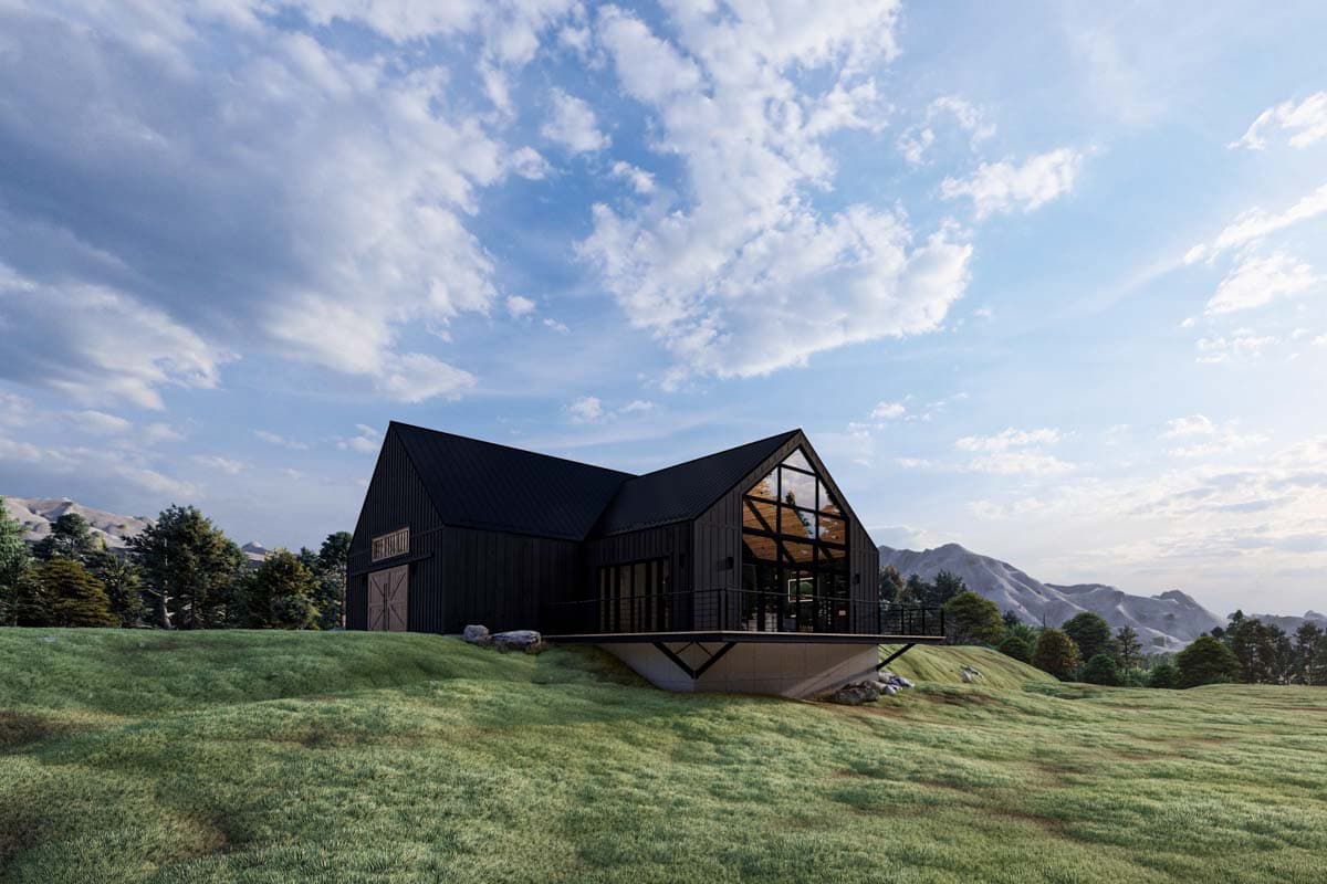 Modern farmhouse exterior with a black metal roof, large gable windows, and a wraparound deck.