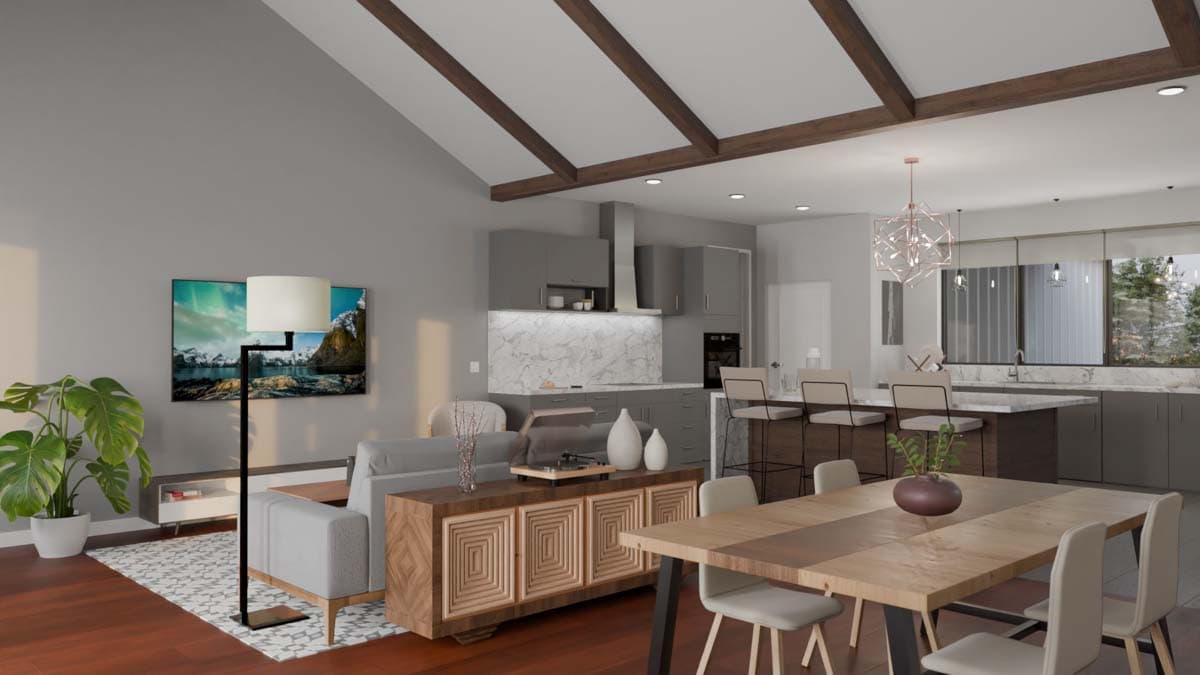 Open concept living area with vaulted ceiling, exposed beams, kitchen island, and dining area.