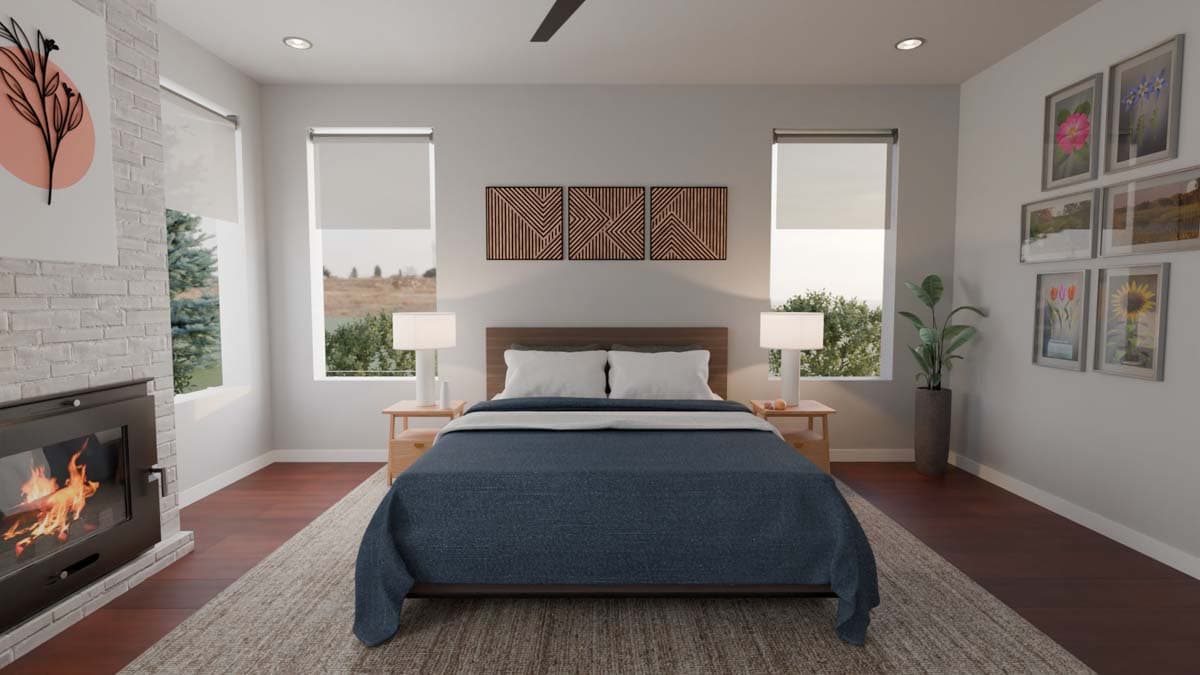 Primary bedroom with fireplace, wood floors, large windows, and wall art.