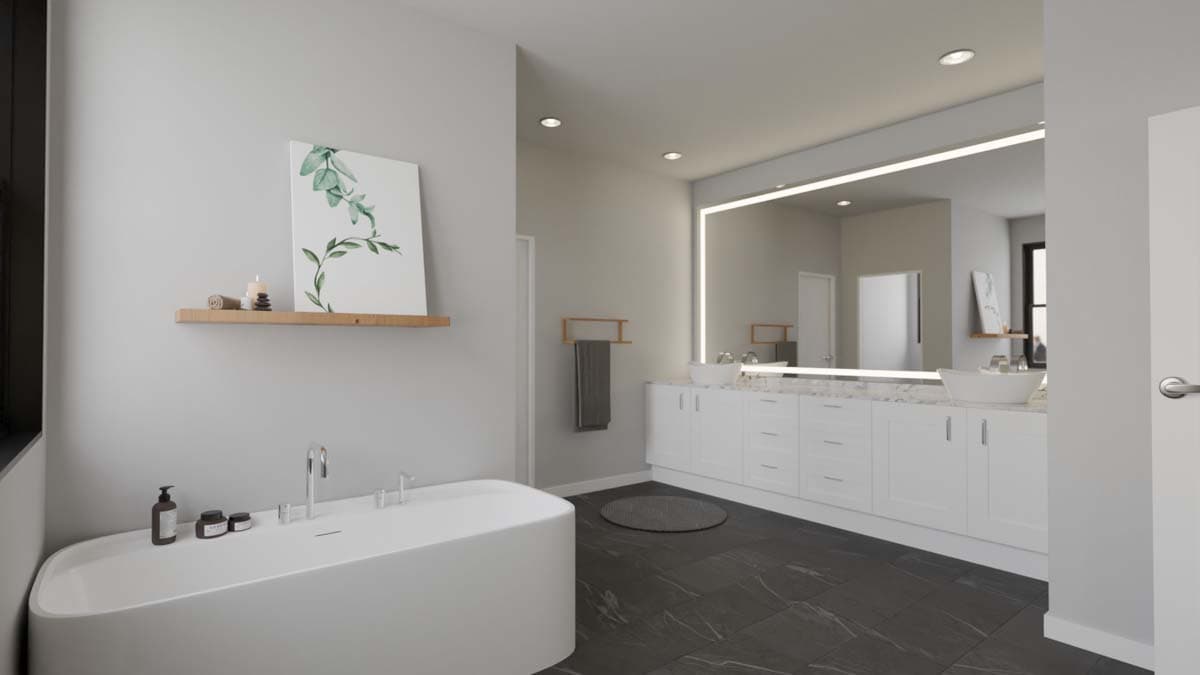 Modern bathroom with freestanding tub, double vanity with integrated sinks, and large backlit mirror.