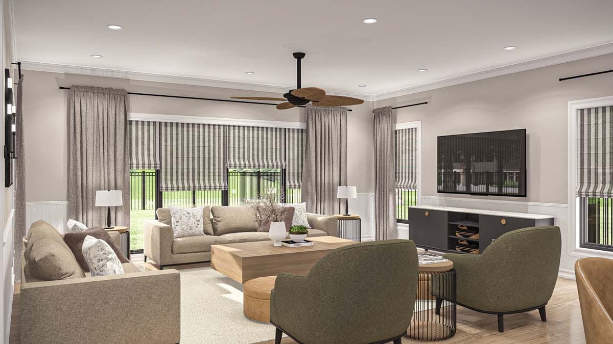 Living room interior with sectional sofas, coffee table, accent chairs, entertainment console, and large windows with striped Roman shades.
