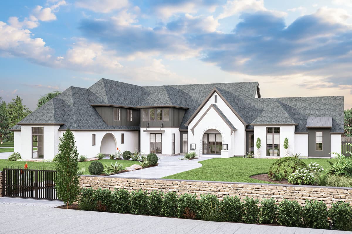 House plan exterior with two stories. Features include a gabled roof, arched entry, and mixed siding. Includes stone wall and gated entrance.