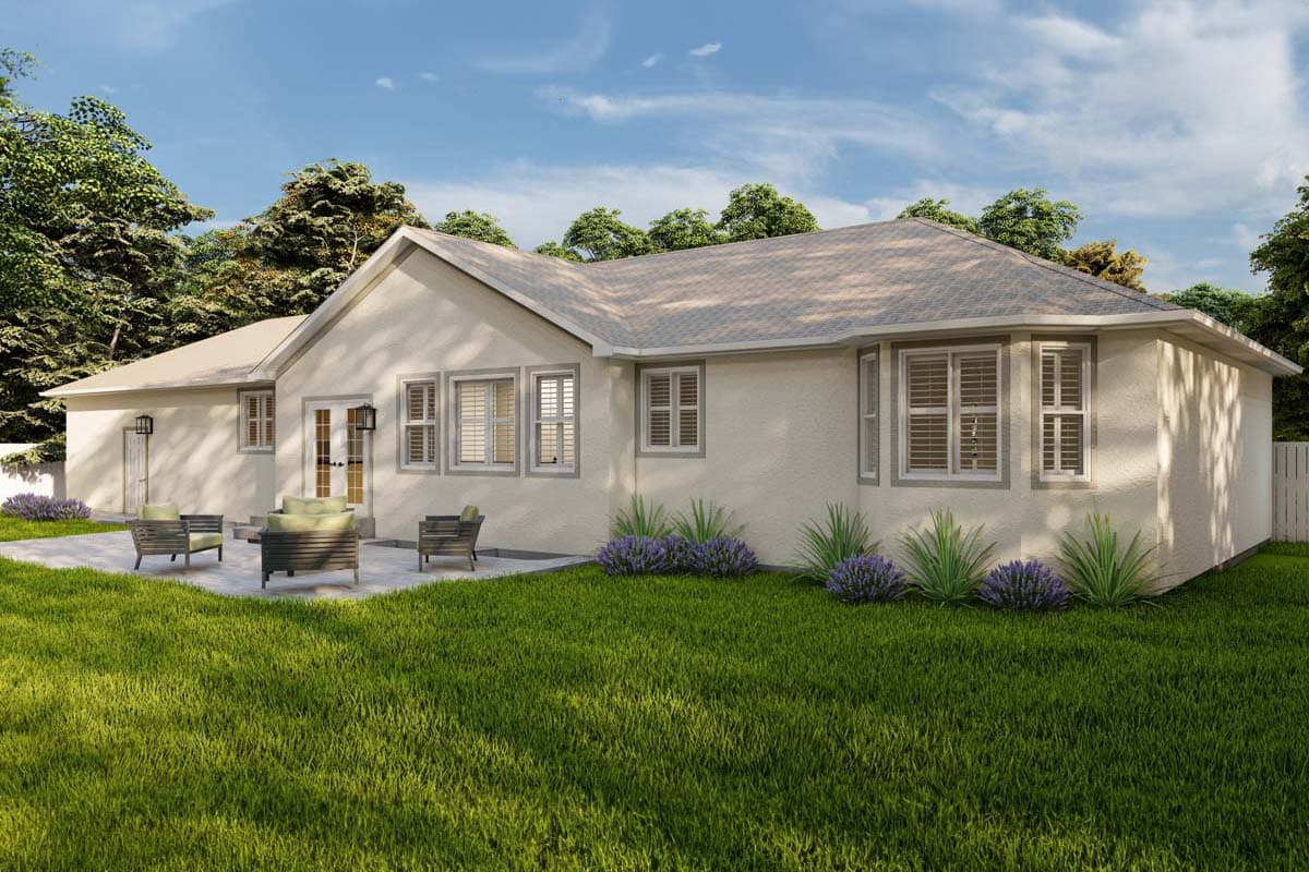 House plan exterior: One-story home with stucco finish, double doors, multiple windows, and a patio area.