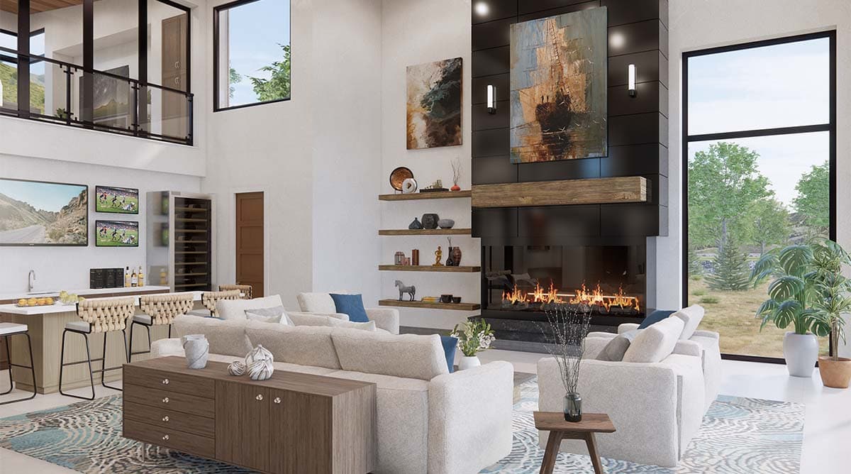 Great room with vaulted ceiling, modern fireplace, bar, and large windows overlooking outdoor scenery.
