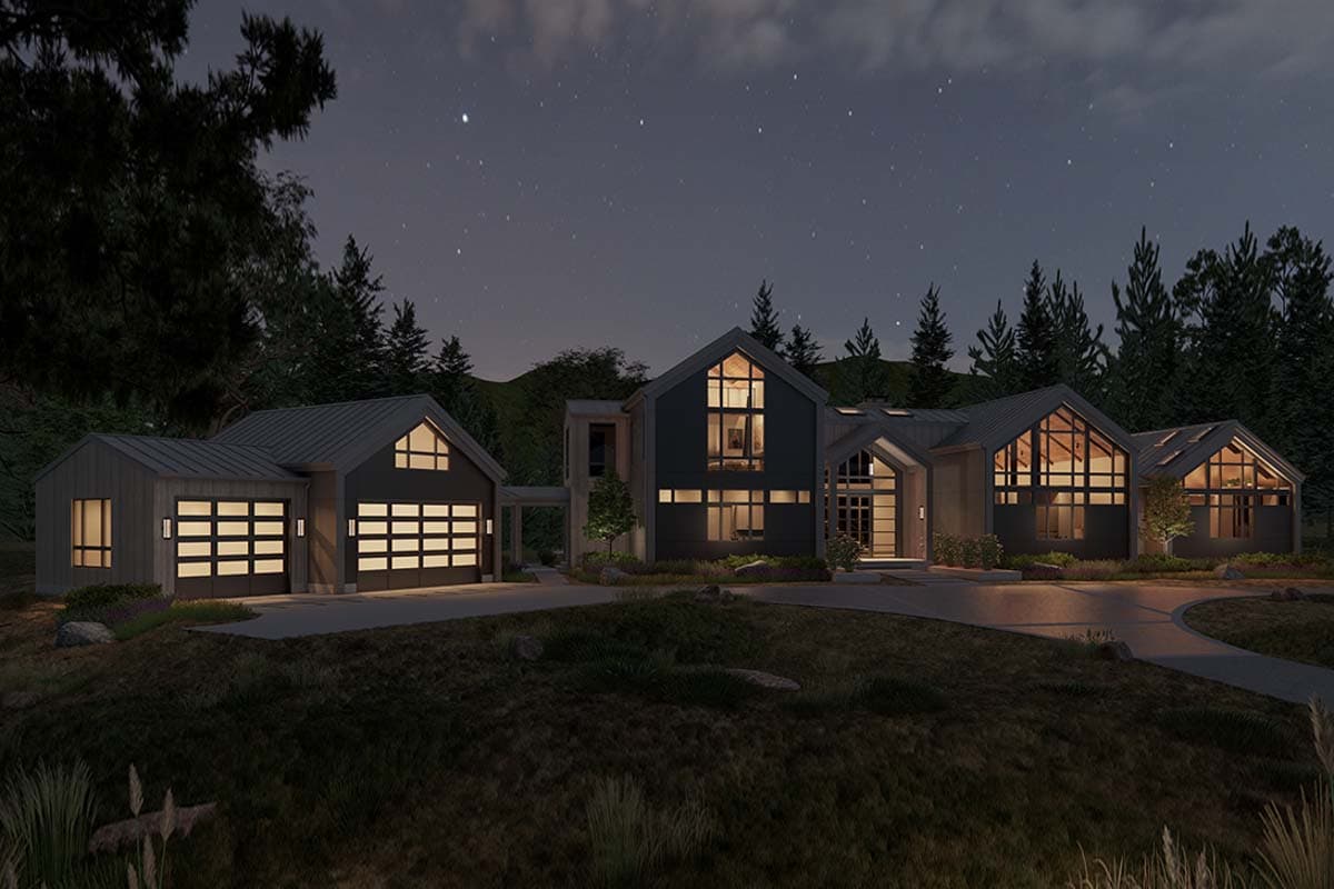 Modern house plan exterior with multiple gables, large windows, a detached garage with glass panel doors, and a metal roof at night.