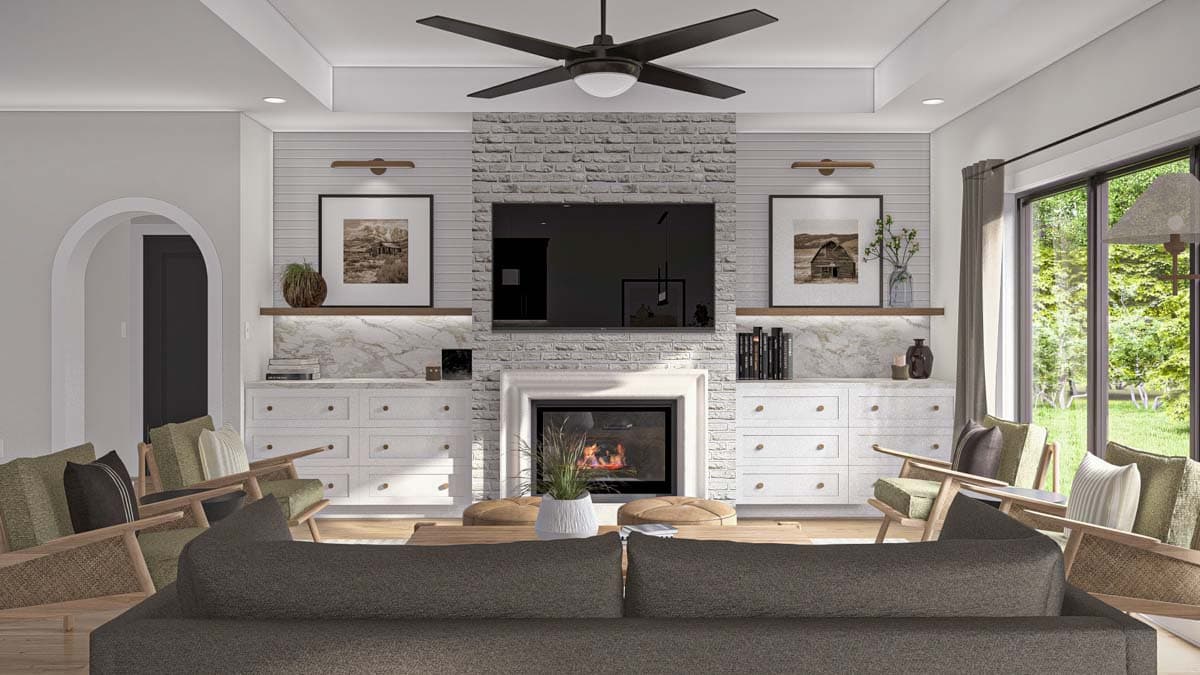 Living room rendering with fireplace, built-in cabinetry, modern ceiling fan, and large windows overlooking a yard.