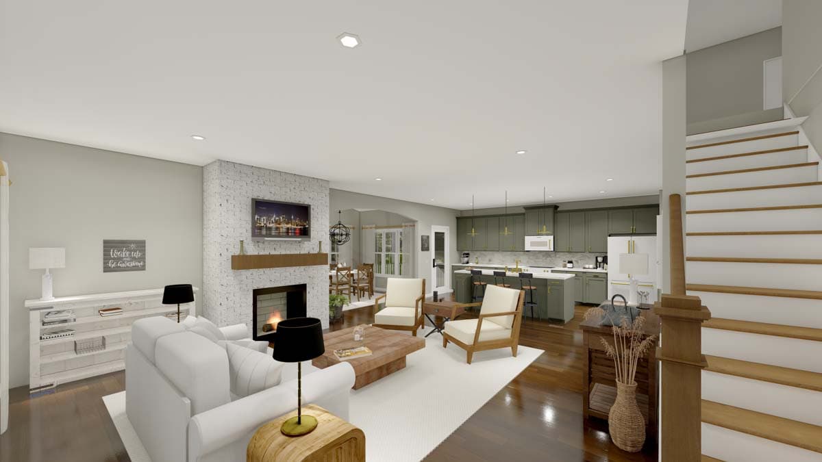 Open-concept living area with fireplace, kitchen island seating, dining area, and stairs.