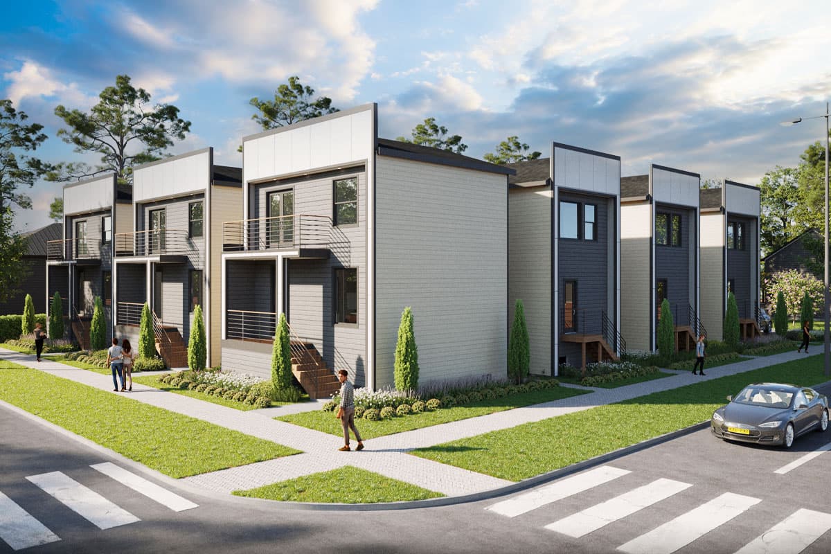 Modern townhouse exterior with three stories, balconies, and contrasting siding.