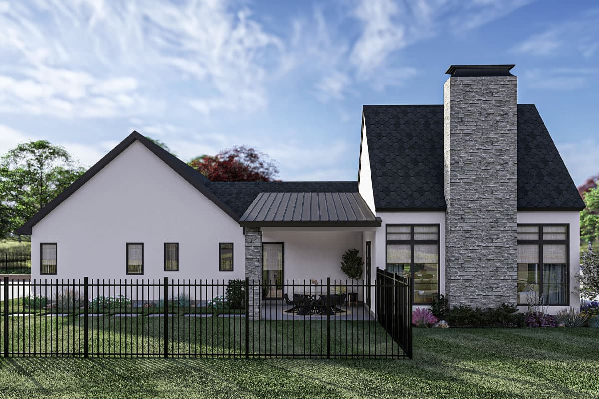 Modern house plan exterior with a prominent stone chimney, covered patio, metal roof accents, and multiple gables.